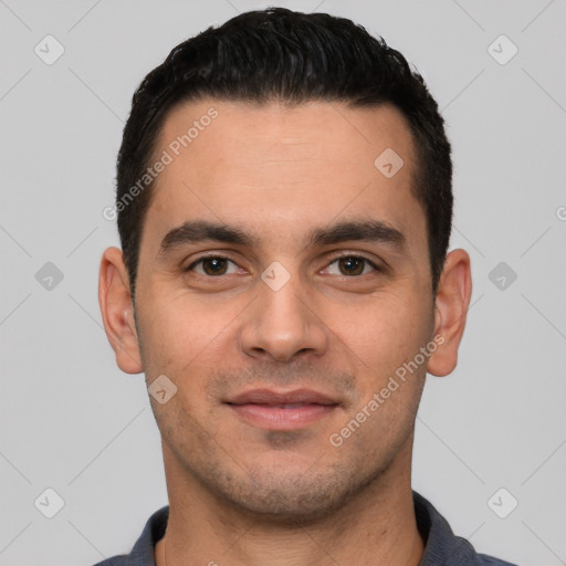 Joyful white young-adult male with short  black hair and brown eyes