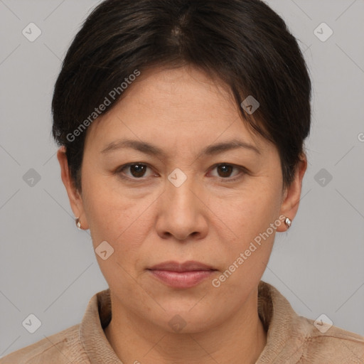 Joyful white adult female with short  brown hair and brown eyes