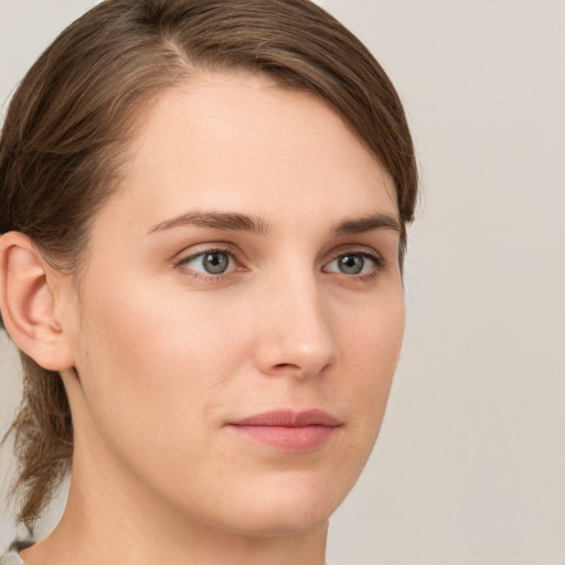 Neutral white young-adult female with medium  brown hair and grey eyes