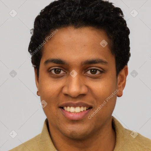 Joyful black young-adult male with short  brown hair and brown eyes