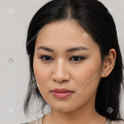 Joyful asian young-adult female with medium  black hair and brown eyes