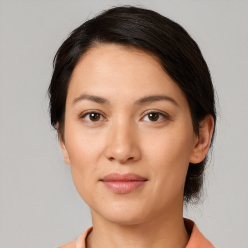Joyful white young-adult female with medium  black hair and brown eyes