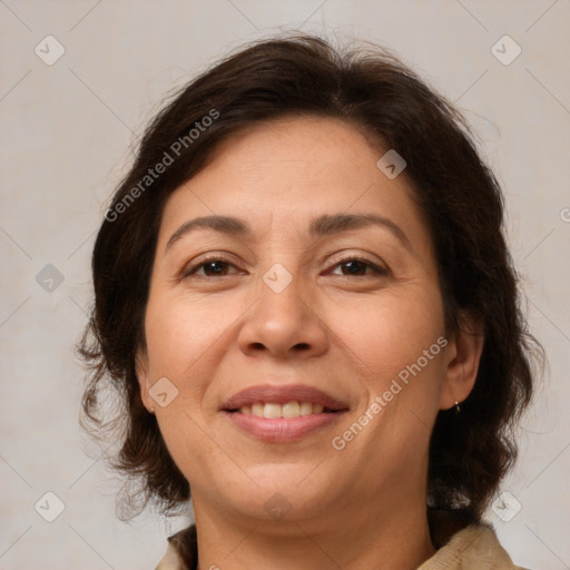 Joyful white adult female with medium  brown hair and brown eyes