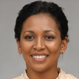 Joyful latino young-adult female with short  brown hair and brown eyes