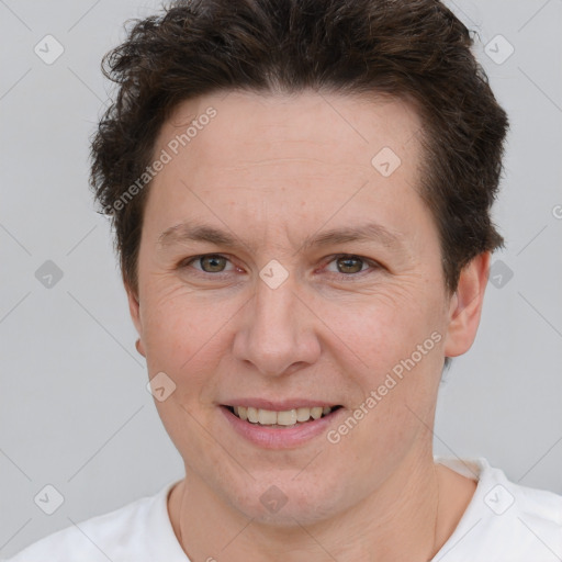 Joyful white adult female with short  brown hair and brown eyes