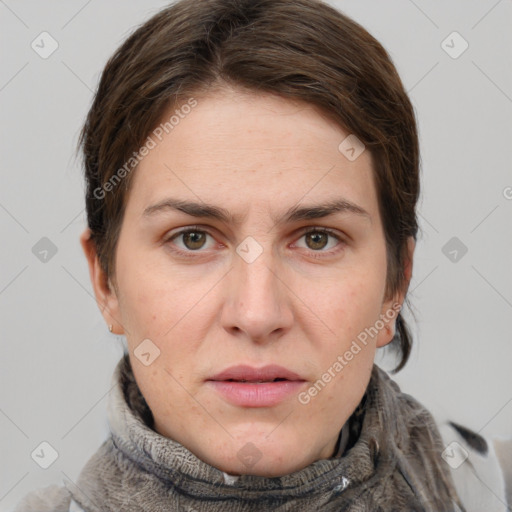 Joyful white adult female with short  brown hair and grey eyes