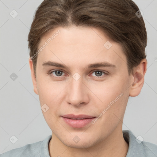 Joyful white young-adult female with short  brown hair and grey eyes