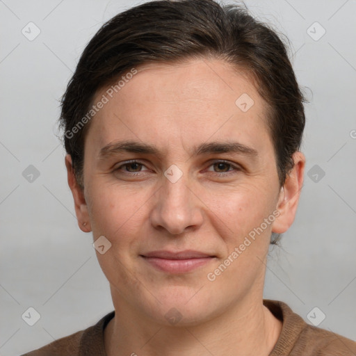 Joyful white adult female with short  brown hair and brown eyes