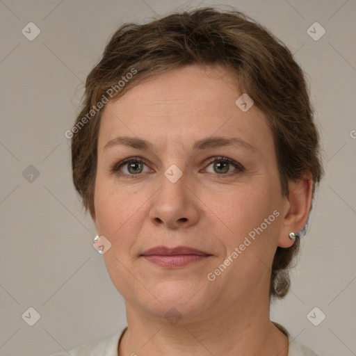 Joyful white adult female with short  brown hair and grey eyes