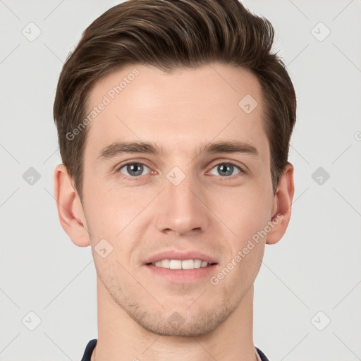 Joyful white young-adult male with short  brown hair and grey eyes