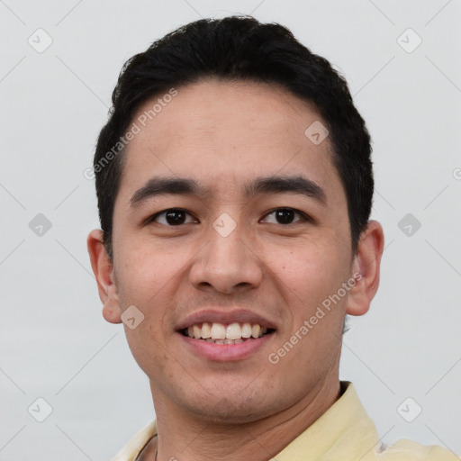 Joyful white young-adult male with short  black hair and brown eyes