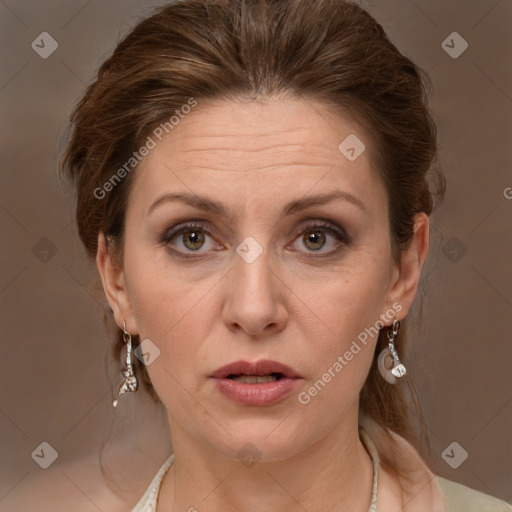 Joyful white adult female with medium  brown hair and grey eyes