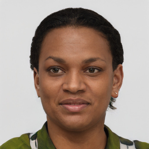 Joyful black young-adult female with short  black hair and brown eyes