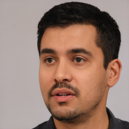 Neutral white young-adult male with short  black hair and brown eyes