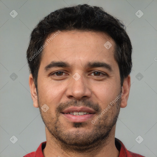 Joyful white young-adult male with short  black hair and brown eyes