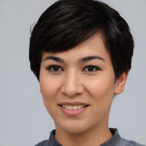 Joyful asian young-adult female with short  brown hair and brown eyes