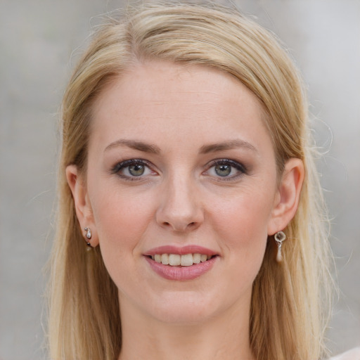 Joyful white young-adult female with medium  brown hair and blue eyes