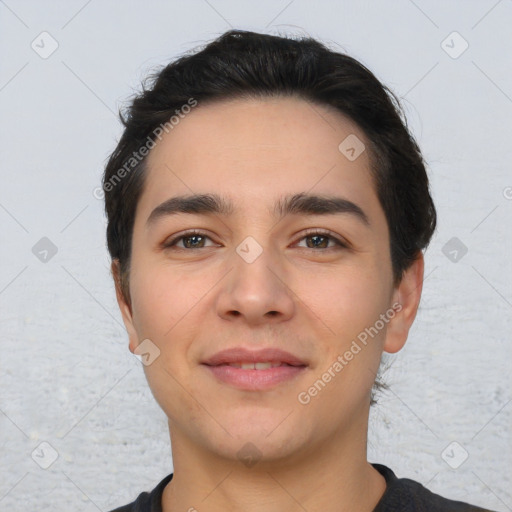 Joyful white young-adult male with short  black hair and brown eyes