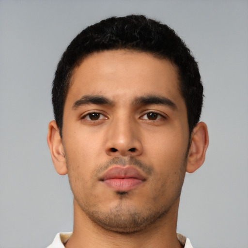 Neutral latino young-adult male with short  black hair and brown eyes