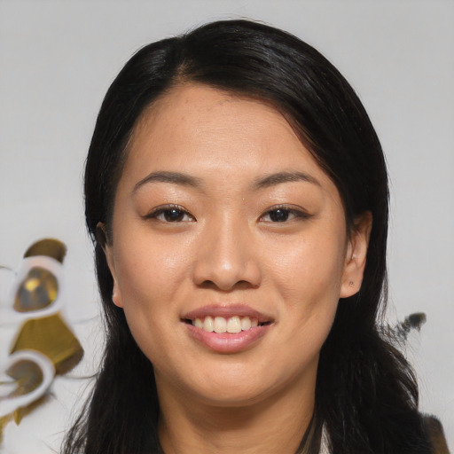 Joyful asian young-adult female with long  black hair and brown eyes