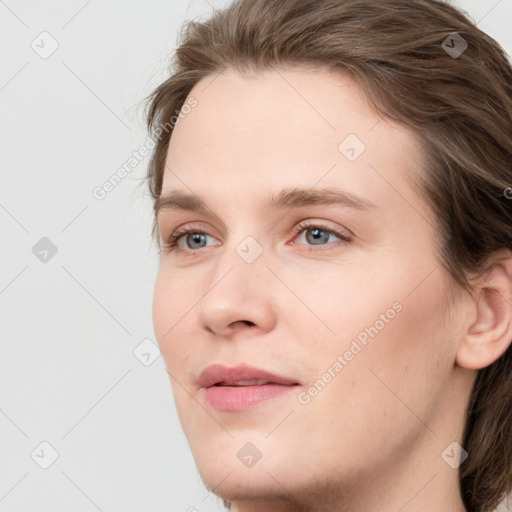 Joyful white young-adult female with medium  brown hair and blue eyes