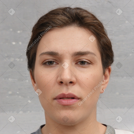 Neutral white young-adult female with short  brown hair and brown eyes