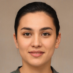 Joyful white young-adult female with medium  brown hair and brown eyes