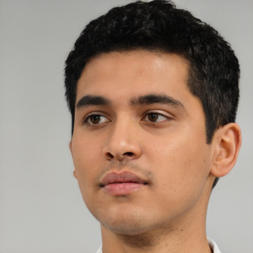 Neutral latino young-adult male with short  black hair and brown eyes