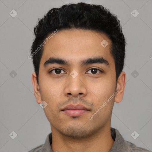 Neutral latino young-adult male with short  black hair and brown eyes