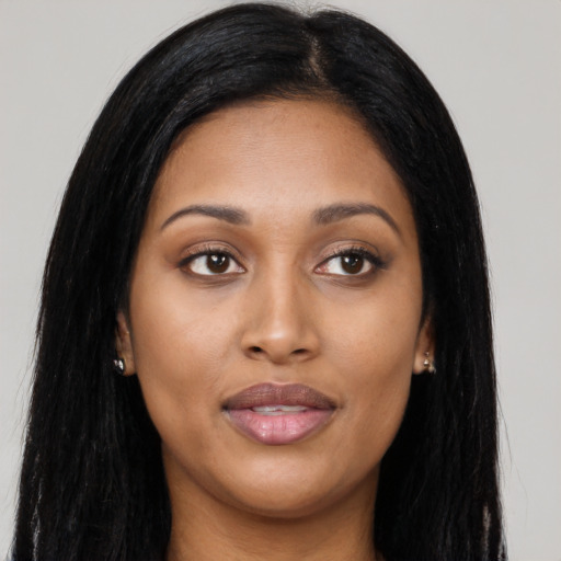 Joyful asian young-adult female with long  black hair and brown eyes