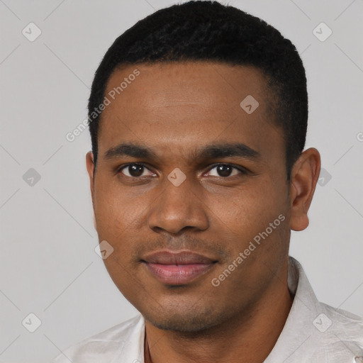 Joyful black young-adult male with short  black hair and brown eyes