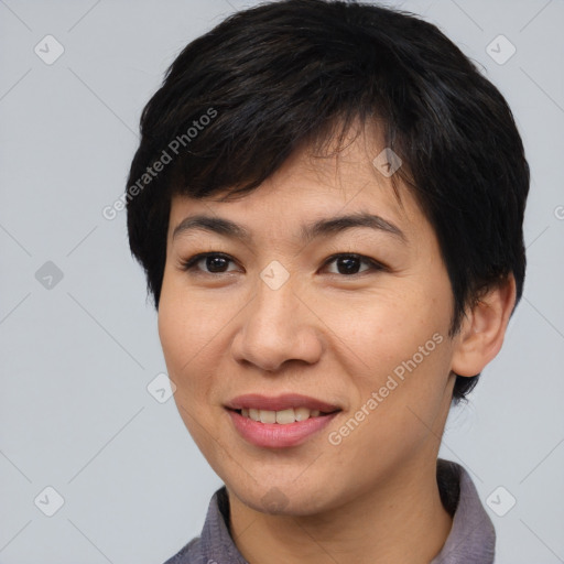 Joyful asian young-adult female with short  brown hair and brown eyes