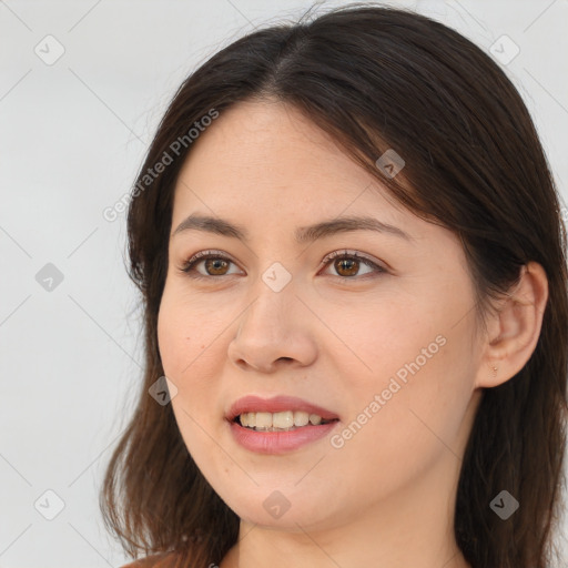 Joyful white young-adult female with long  brown hair and brown eyes