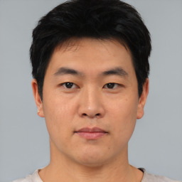 Neutral asian young-adult male with short  black hair and brown eyes