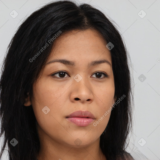 Joyful latino young-adult female with long  brown hair and brown eyes