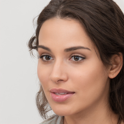 Neutral white young-adult female with long  brown hair and brown eyes