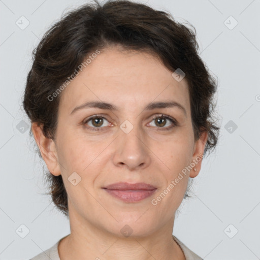 Joyful white adult female with short  brown hair and brown eyes