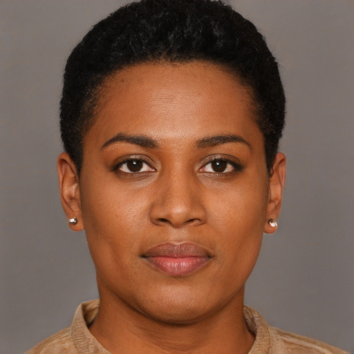Joyful black young-adult female with short  brown hair and brown eyes