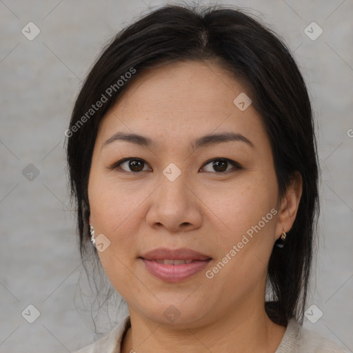 Joyful asian adult female with medium  brown hair and brown eyes