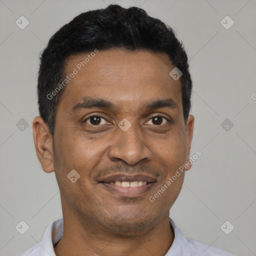 Joyful latino adult male with short  black hair and brown eyes