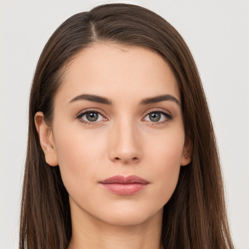 Neutral white young-adult female with long  brown hair and brown eyes