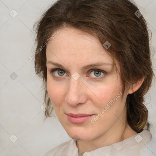 Joyful white adult female with medium  brown hair and blue eyes