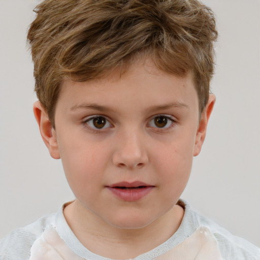 Joyful white child male with short  brown hair and brown eyes