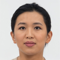 Joyful asian young-adult female with short  brown hair and brown eyes