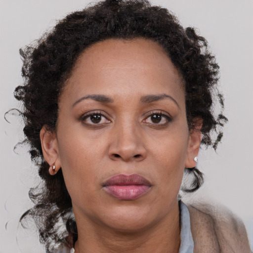 Neutral black adult female with short  brown hair and brown eyes