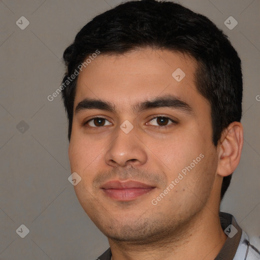 Joyful white young-adult male with short  black hair and brown eyes