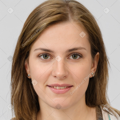 Joyful white young-adult female with long  brown hair and green eyes