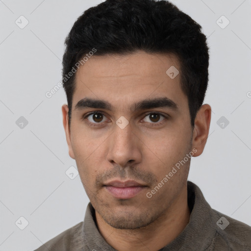 Neutral latino young-adult male with short  black hair and brown eyes