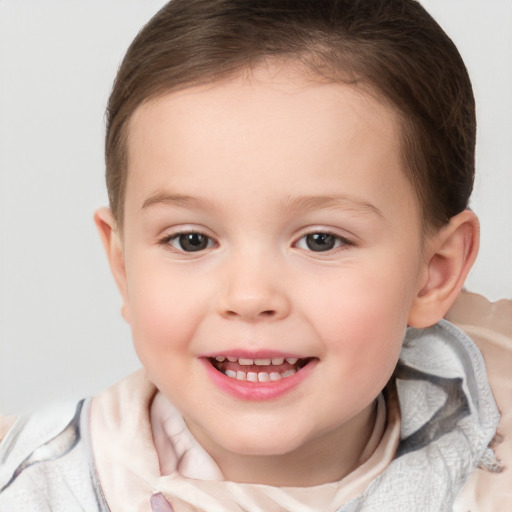 Joyful white child female with medium  brown hair and brown eyes