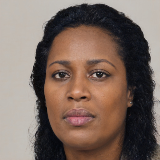 Neutral black young-adult female with long  black hair and brown eyes